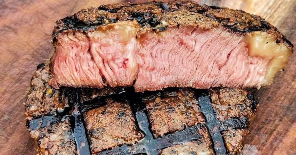 Steak, steak temperatures, medium steak, medium rare steak, meat temperatures, medium doneness steak on a wooden board