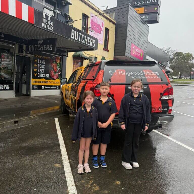 Triple M winners, in front of The MEat Inn Place